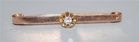 A 9ct gold and solitaire diamond set tie pin, 50mm.